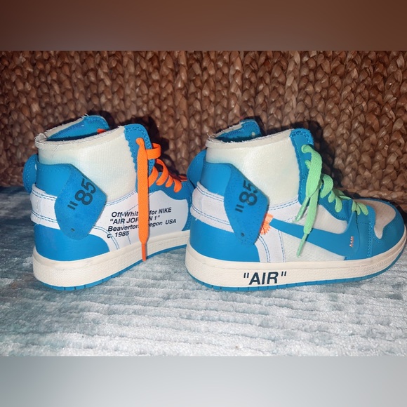 blue jordan’s with green and orange laces